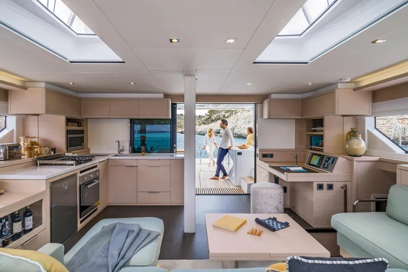 Slide: The Image of Luxurious interior of 2026 Lagoon 55 yacht with modern kitchen and spacious living area. - 13