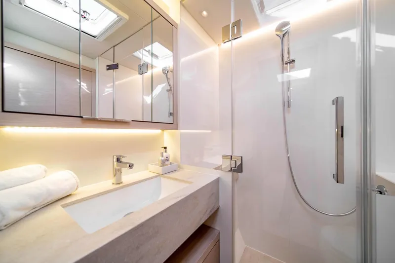 Slide: The Image of Luxurious bathroom in 2026 Lagoon 55 yacht, featuring modern fixtures and elegant design. - 16