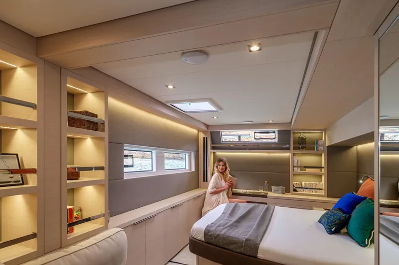 Slide: The Image of Luxurious interior of 2026 Lagoon 55 yacht with modern design and cozy bedroom. - 3