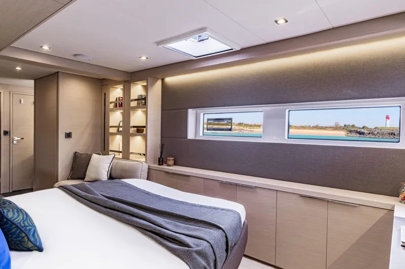 Slide: The Image of Luxurious interior of 2026 Lagoon 55 yacht with modern design and scenic window views. - 6