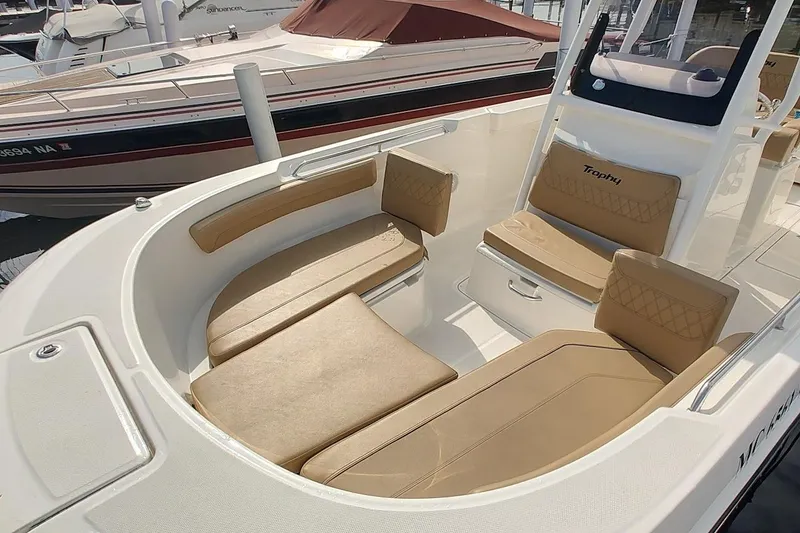 Slide: The Image of 2024 Bayliner Trophy T24CC boat interior with tan seating and modern design. - 3
