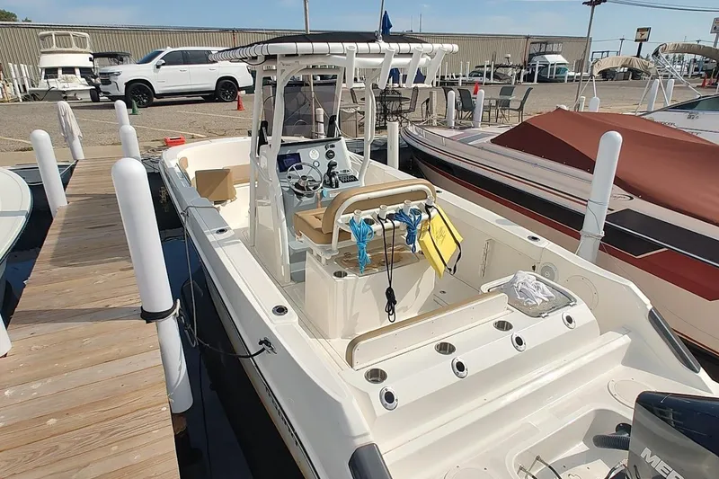 Slide: The Image of 2024 Bayliner Trophy T24CC boat docked, showcasing sleek design and modern features. - 8