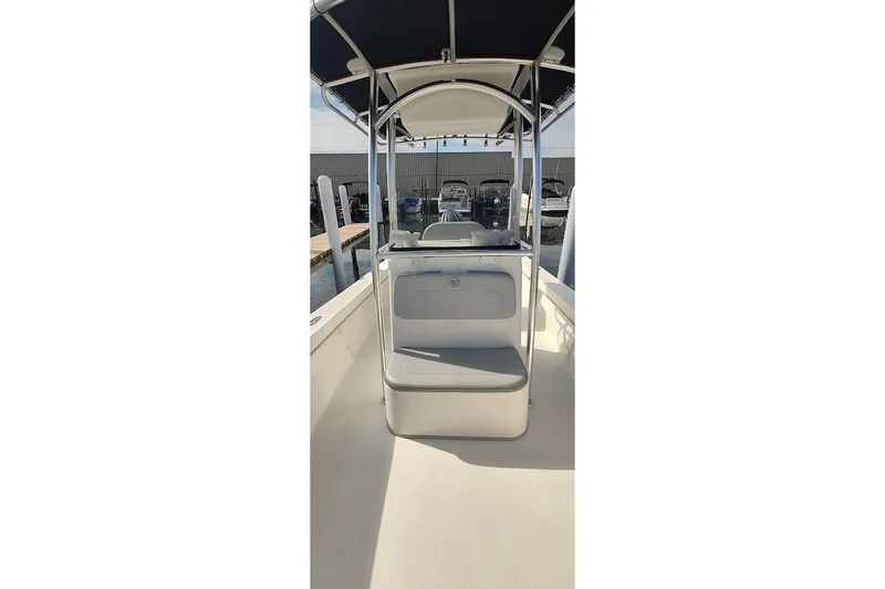 Slide: The Image of 2024 May-Craft 23 Cape Classic boat interior with seating and canopy. - 6