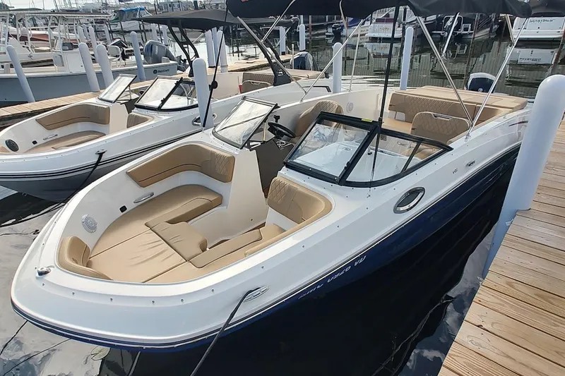 The Image of 2025 Bayliner VR6 Bowrider OB docked, featuring spacious seating and sleek design. - 0