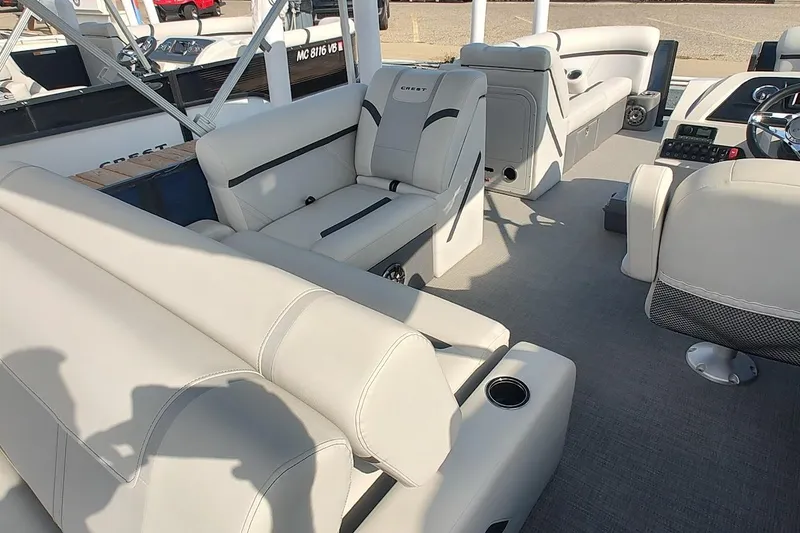 Slide: The Image of 2023 Crest Classic LX 220 boat interior with luxurious seating and modern design. - 9