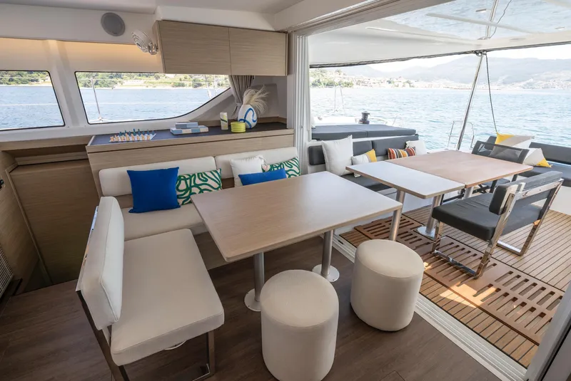 Slide: The Image of Luxurious interior of 2026 Lagoon 43 yacht with modern seating and ocean view. - 10