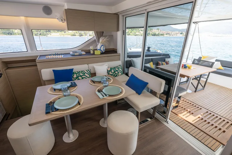 Slide: The Image of Modern interior of 2026 Lagoon 43 yacht with dining area and ocean view. - 6