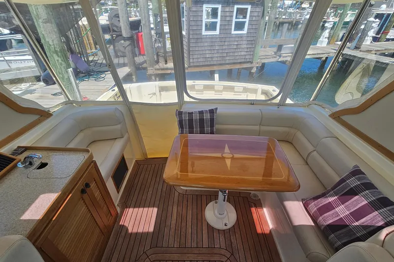 Slide: The Image of 2009 Sabre 42 Express yacht docked in a marina under clear blue skies. - 17