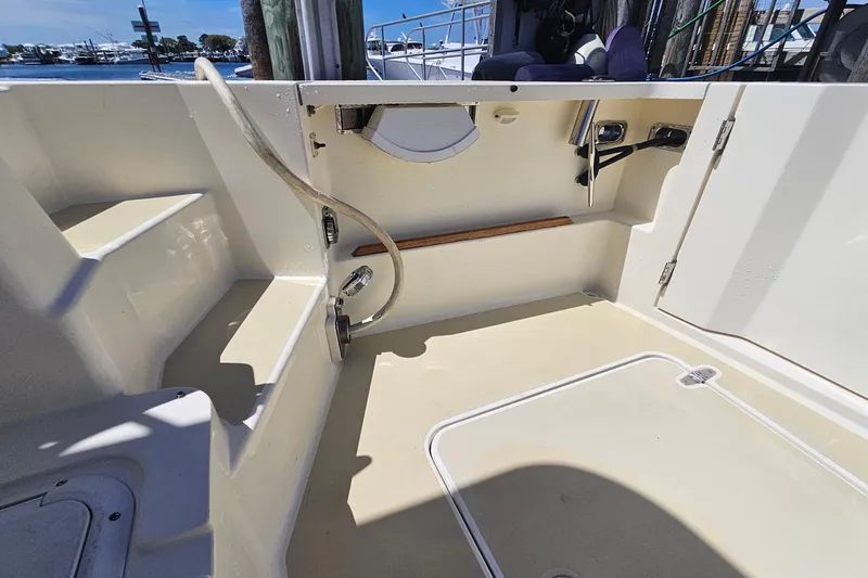 Slide: The Image of 2009 Sabre 42 Express yacht docked, featuring sleek design and elegant navy hull. - 20