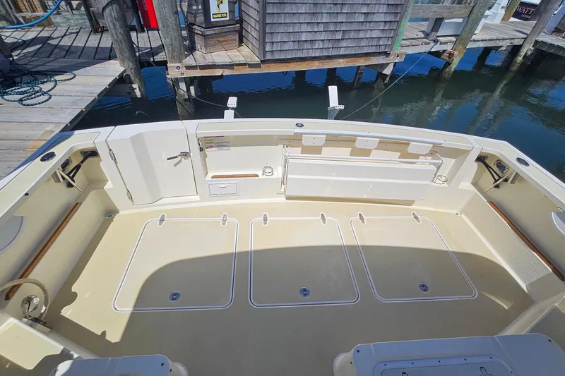 Slide: The Image of 2009 Sabre 42 Express yacht docked at marina, showcasing sleek design and spacious cabin. - 22