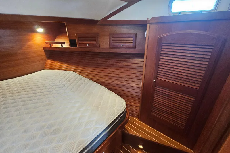 Slide: The Image of Overhead view of a 2009 Sabre 42 Express yacht docked at a wooden pier. - 25