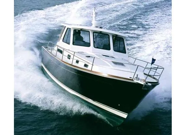 Slide: The Image of 2009 Sabre 42 Express yacht on water, American flag, scenic background. - 3