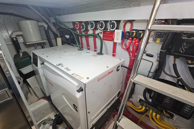 Slide: The Image of 2009 Sabre 42 Express boat cockpit with clean deck and dockside view. - 43