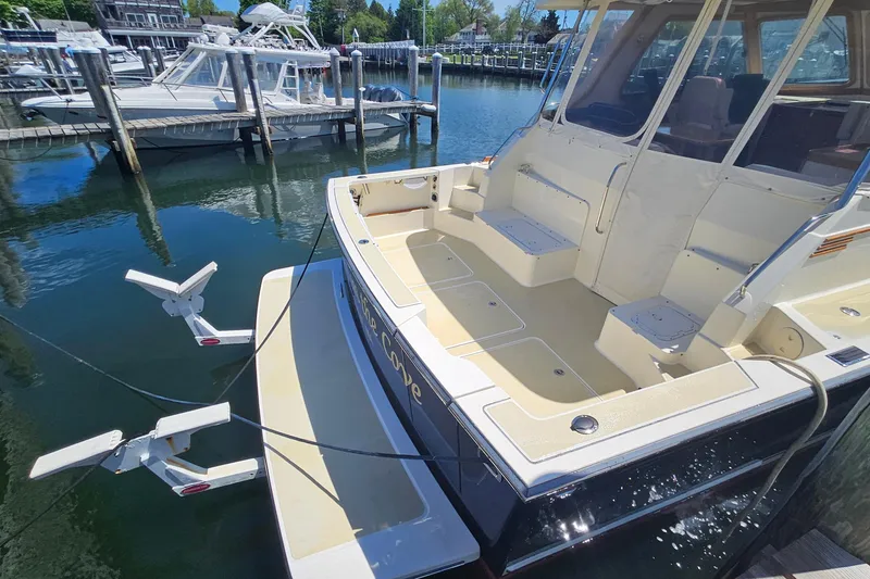 Slide: The Image of 2009 Sabre 42 Express cabin with wooden interior and cozy bed. - 47