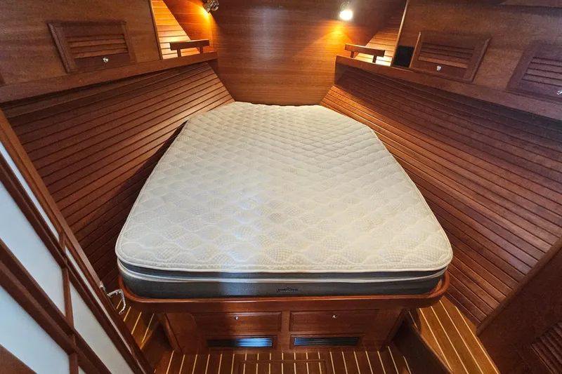 Slide: The Image of Luxurious wooden cabin interior of 2009 Sabre 42 Express yacht with cozy bed. - 48