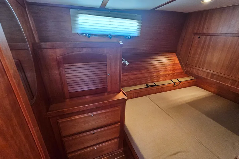 Slide: The Image of Cozy cabin interior of 2009 Sabre 42 Express yacht with wooden furnishings. - 59