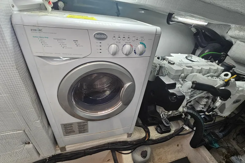 Slide: The Image of Washing machine and engine in 2009 Sabre 42 Express boat interior. - 64