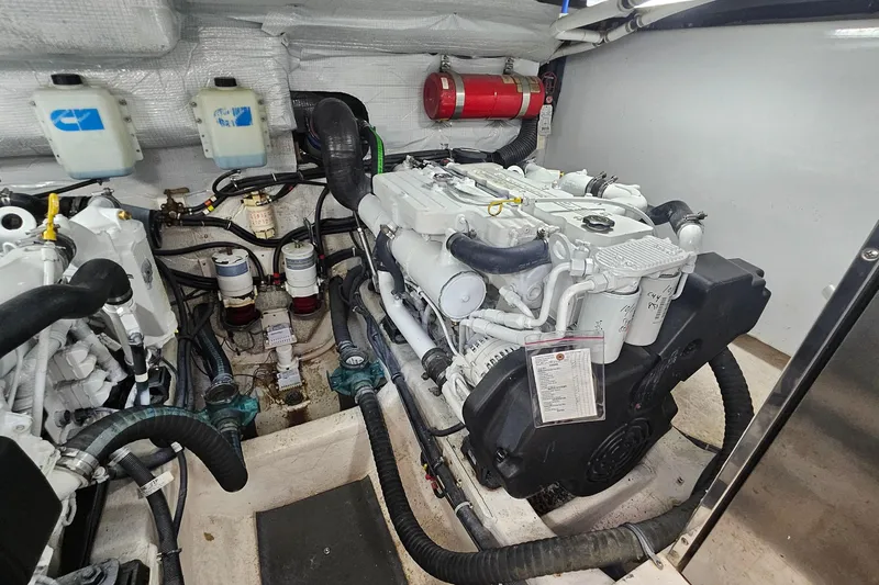 Slide: The Image of Engine room of 2009 Sabre 42 Express yacht, showcasing detailed mechanical components. - 66