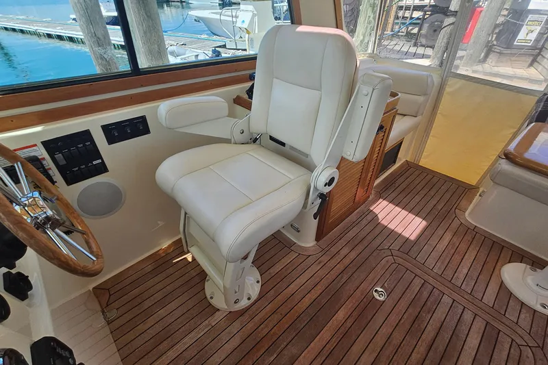 Slide: The Image of 2009 Sabre 42 Express yacht on calm water with American flag. - 8