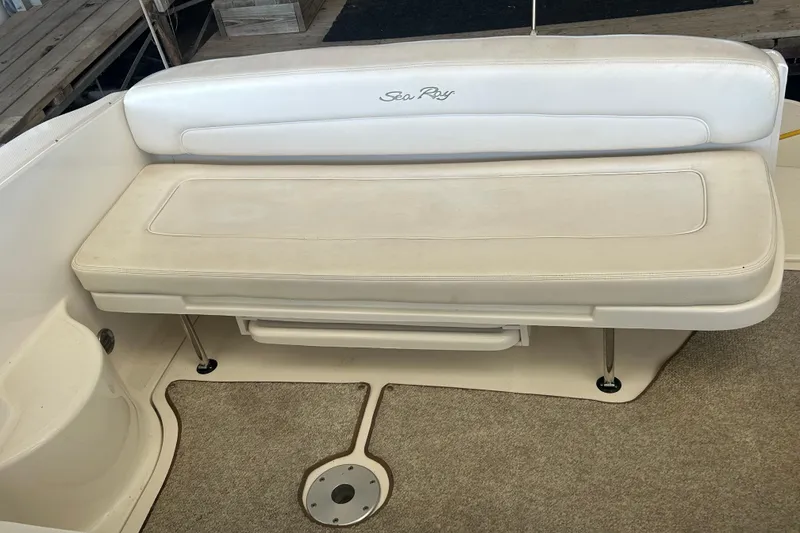 Slide: The Image of 2005 Sea Ray 300 Sundancer cabin interior with bed, TV, and cozy decor. - 11