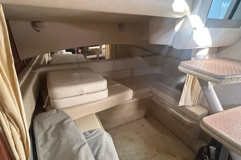 Slide: The Image of Engine compartment of a 2005 Sea Ray 300 Sundancer with visible batteries and components. - 5