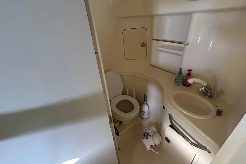 Slide: The Image of Engine compartment of a 2005 Sea Ray 300 Sundancer with dual engines and batteries. - 6