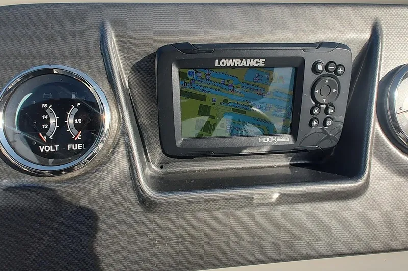 Slide: The Image of Dashboard of 2024 Crest Classic LX 220 with Lowrance GPS and gauges. - 7