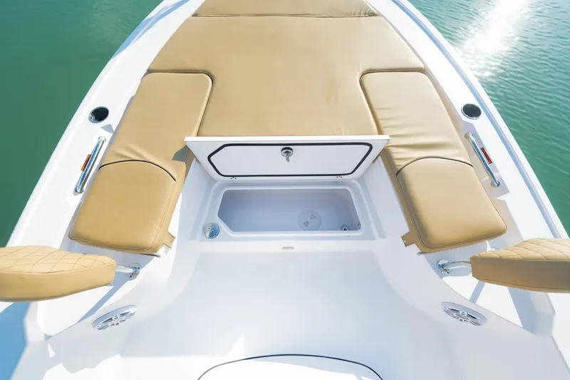 Slide: The Image of 2026 Sportsman Masters 247 Bay Boat with tan seating and storage compartment. - 3