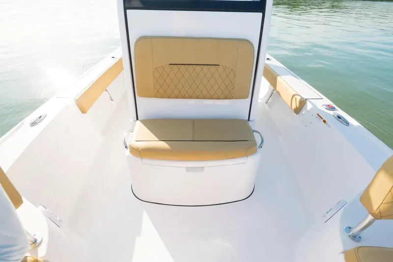 Slide: The Image of 2026 Sportsman Masters 247 Bay Boat interior with tan seating and sleek design. - 6