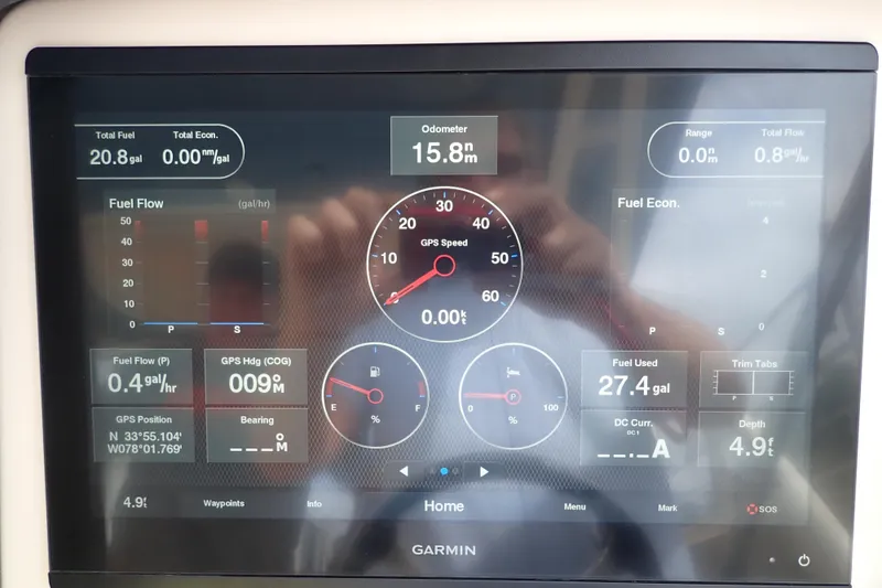 Slide: The Image of Garmin display on 2021 Grady-White Freedom 275 showing fuel and navigation data. - 18