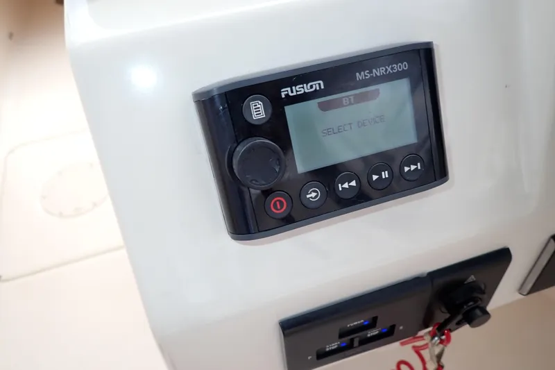 Slide: The Image of Fusion MS-NRX300 audio system on 2021 Grady-White Freedom 275 boat dashboard. - 19