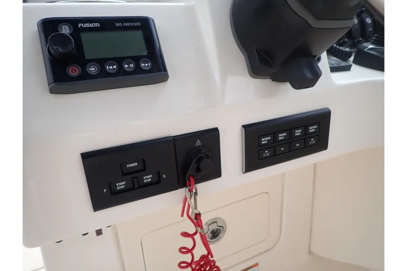 Slide: The Image of Control panel of 2021 Grady-White Freedom 275 boat with Fusion MS-NRX300 system. - 20