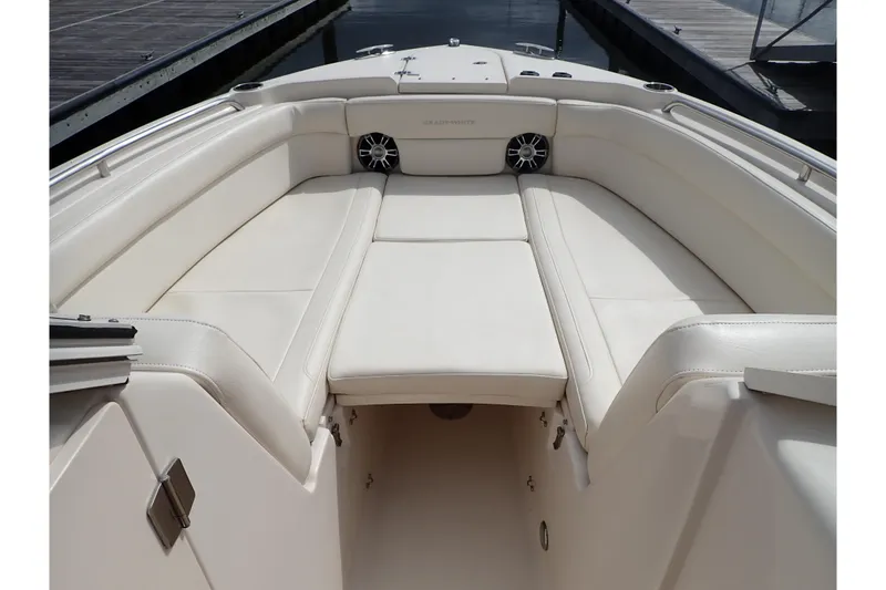 Slide: The Image of 2021 Grady-White Freedom 275 boat interior with white cushioned seating. - 34