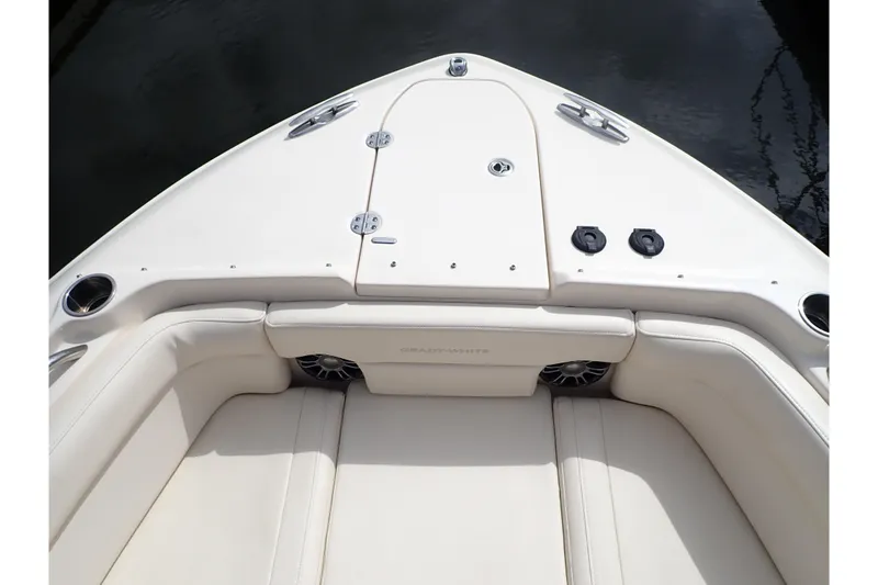 Slide: The Image of 2021 Grady-White Freedom 275 boat interior with cushioned seating and storage compartments. - 35