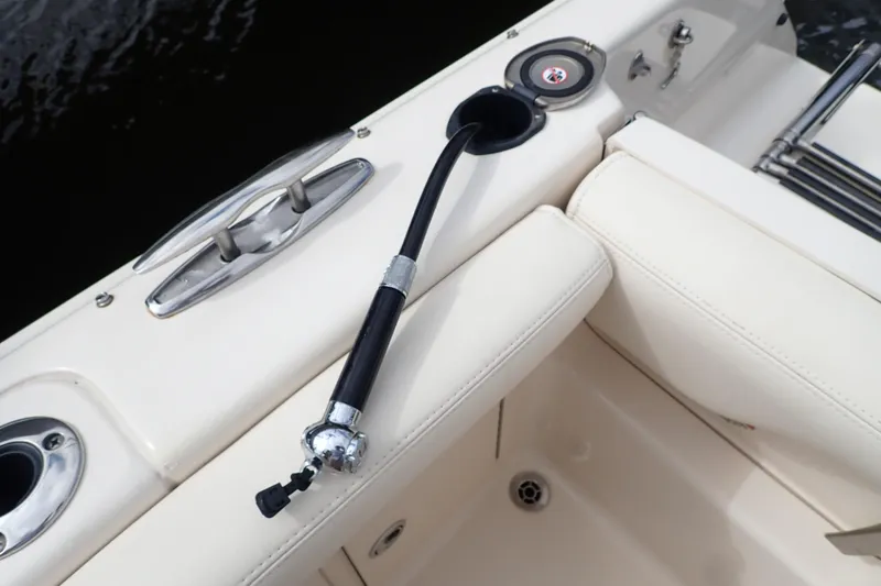 Slide: The Image of 2021 Grady-White Freedom 275 boat deck with hose and cleat detail. - 41