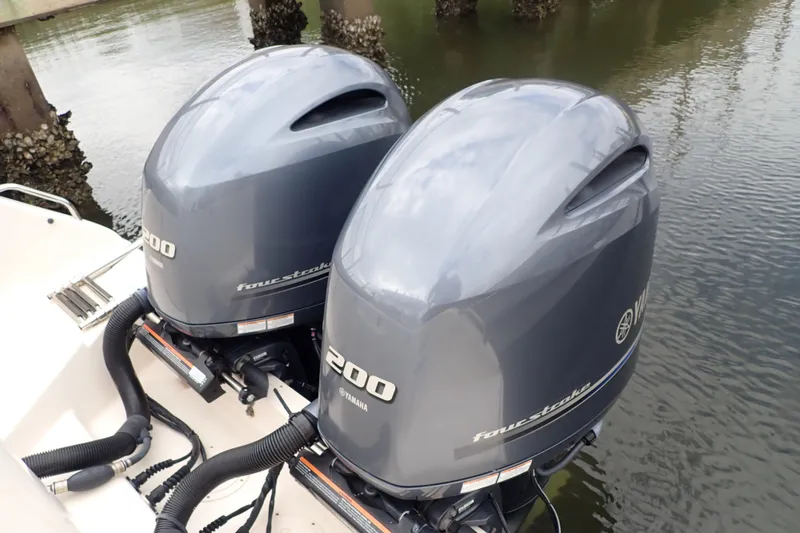 Slide: The Image of Twin Yamaha 200 outboard engines on a 2021 Grady-White Freedom 275 boat. - 46