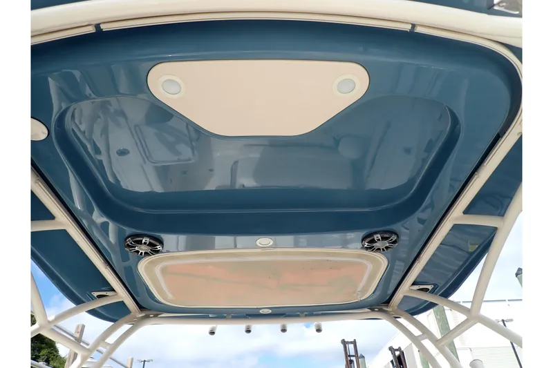 Slide: The Image of 2021 Grady-White Freedom 275 boat roof with speakers and lighting fixtures. - 49