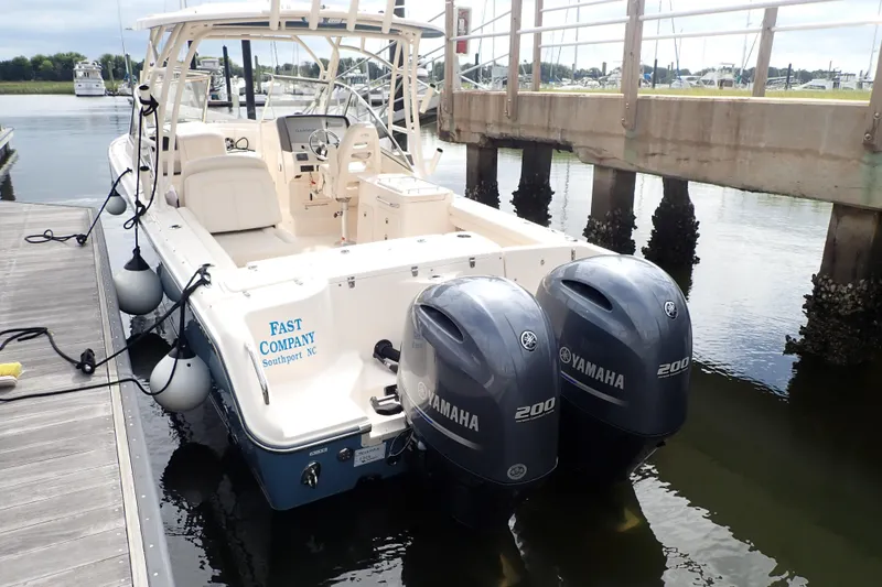 Slide: The Image of 2021 Grady-White Freedom 275 boat docked with twin Yamaha 200 engines. - 5