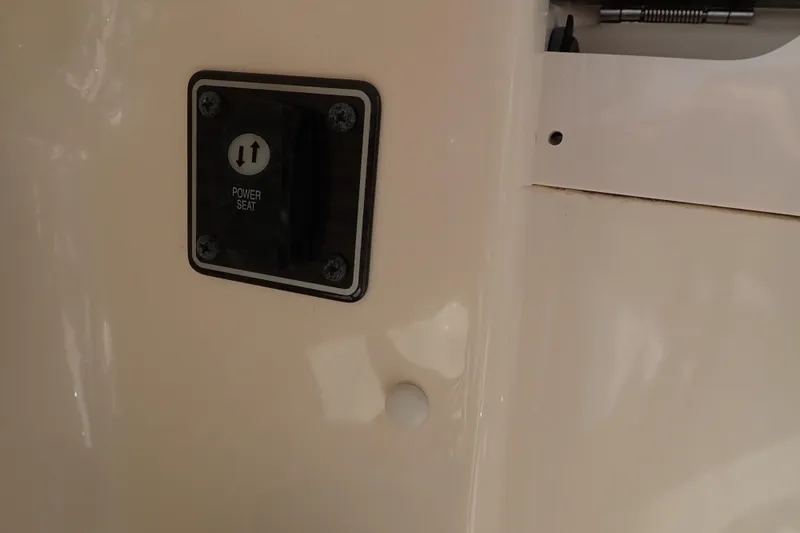 Slide: The Image of Power seat control on 2021 Grady-White Freedom 275 boat interior. - 51