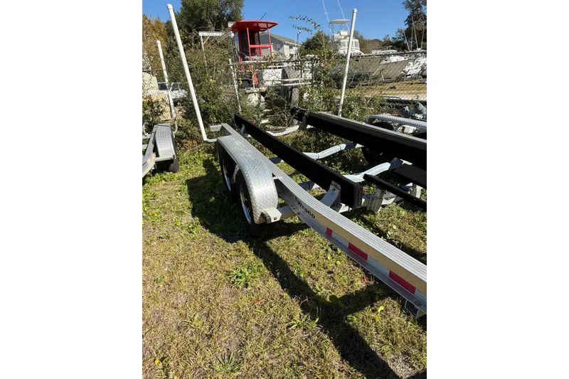 Slide: The Image of Boat trailer for 2021 Grady-White Freedom 275 on grassy lot. - 53