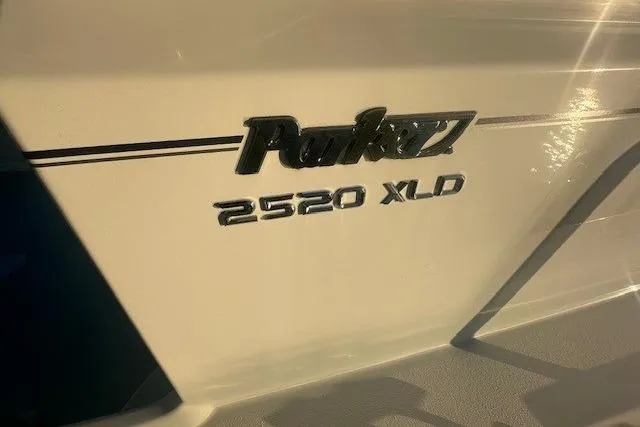 Slide: The Image of 2022 Parker 2520 XLD Sport Cabin boat logo in sunlight. - 5