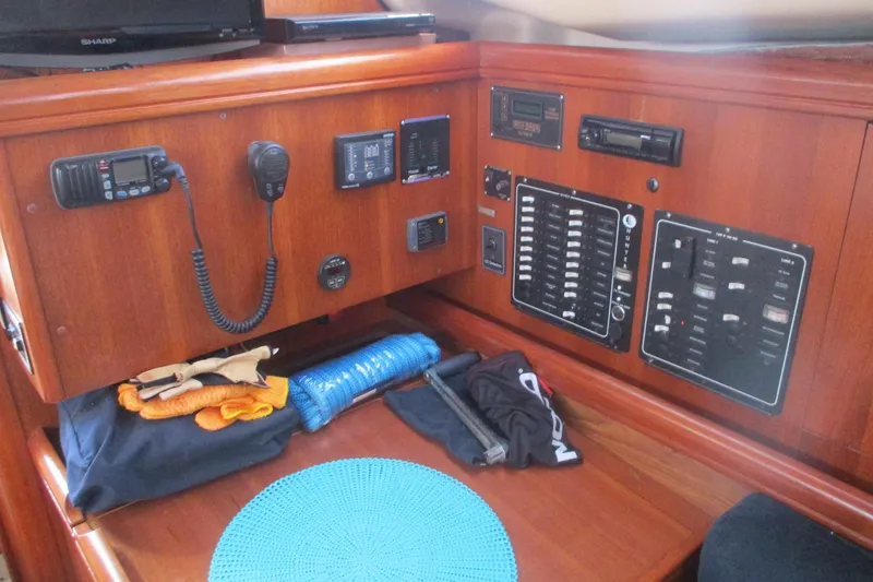 Slide: The Image of Control panel of a 2003 Hunter 356 sailboat with communication equipment and accessories. - 11