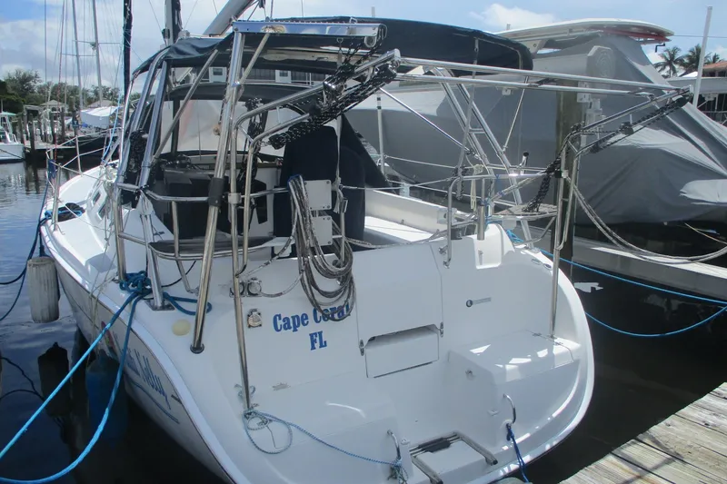 Slide: The Image of 2003 Hunter 356 sailboat docked in Cape Coral, Florida marina. - 2