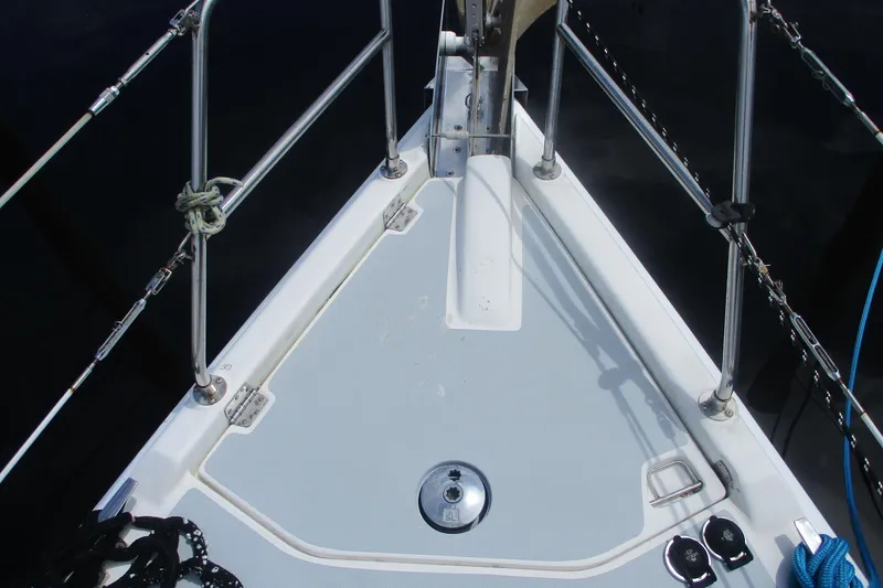 Slide: The Image of Bow of 2003 Hunter 356 sailboat with stainless steel railings and deck fittings. - 27