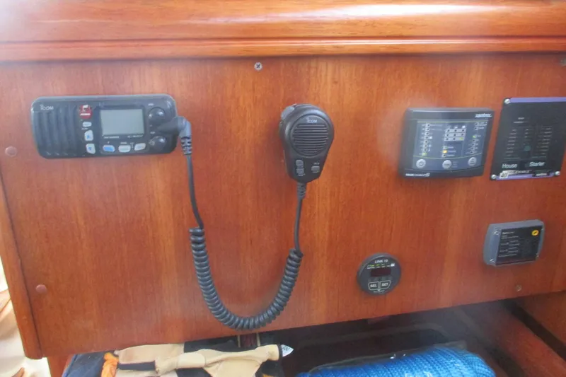 Slide: The Image of Control panel of a 2003 Hunter 356 sailboat with communication equipment. - 30
