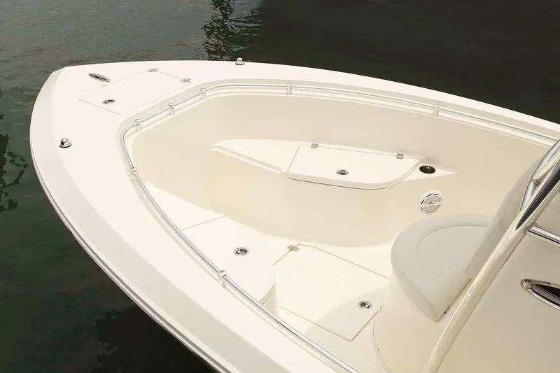 Slide: The Image of Manufacturer Provided Image: 2020 Cobia 237 Center Console boat bow area with seating and storage compartments. - 11