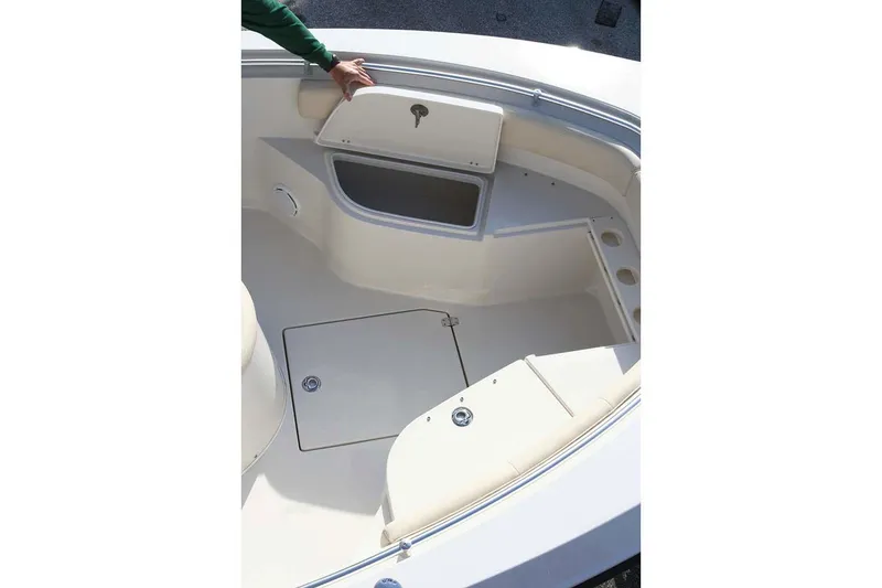 Slide: The Image of Manufacturer Provided Image: 2020 Cobia 237 Center Console boat interior with storage compartments and seating. - 13