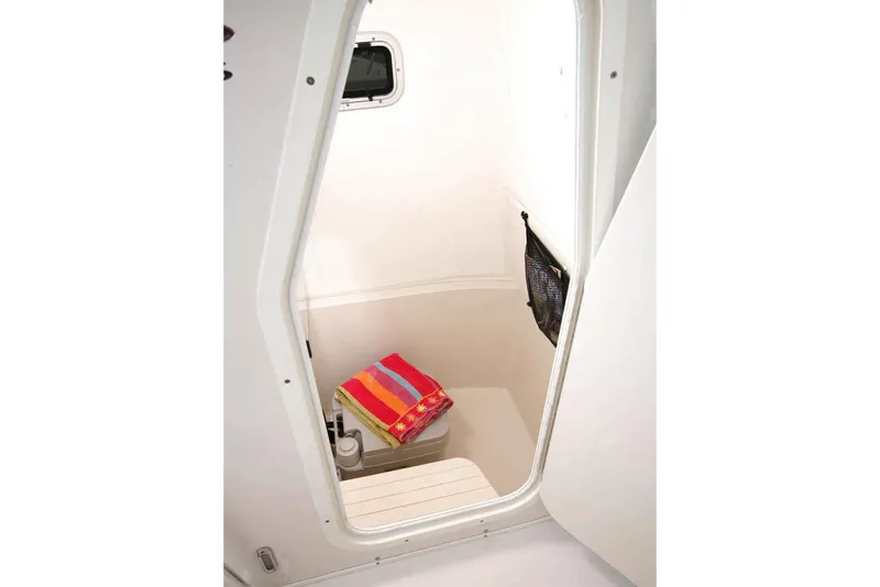 Slide: The Image of Manufacturer Provided Image: Interior cabin of 2020 Cobia 237 Center Console boat with colorful towel. - 14