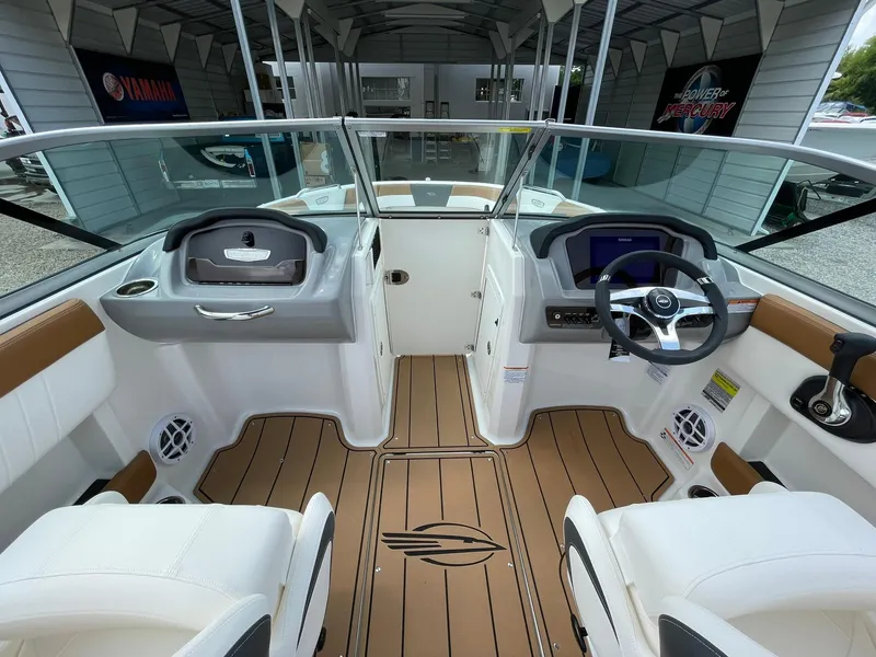 Slide: The Image of Interior of 2026 Chaparral 21 SSi boat with modern dashboard and seating. - 14