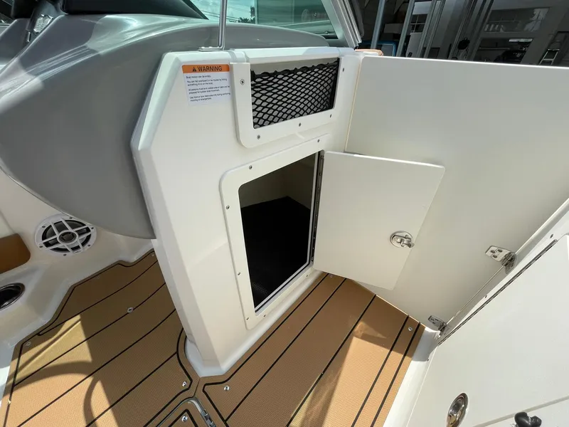 Slide: The Image of 2026 Chaparral 21 SSi capacity label: 12 persons or 1692 lbs, safety compliance. - 17